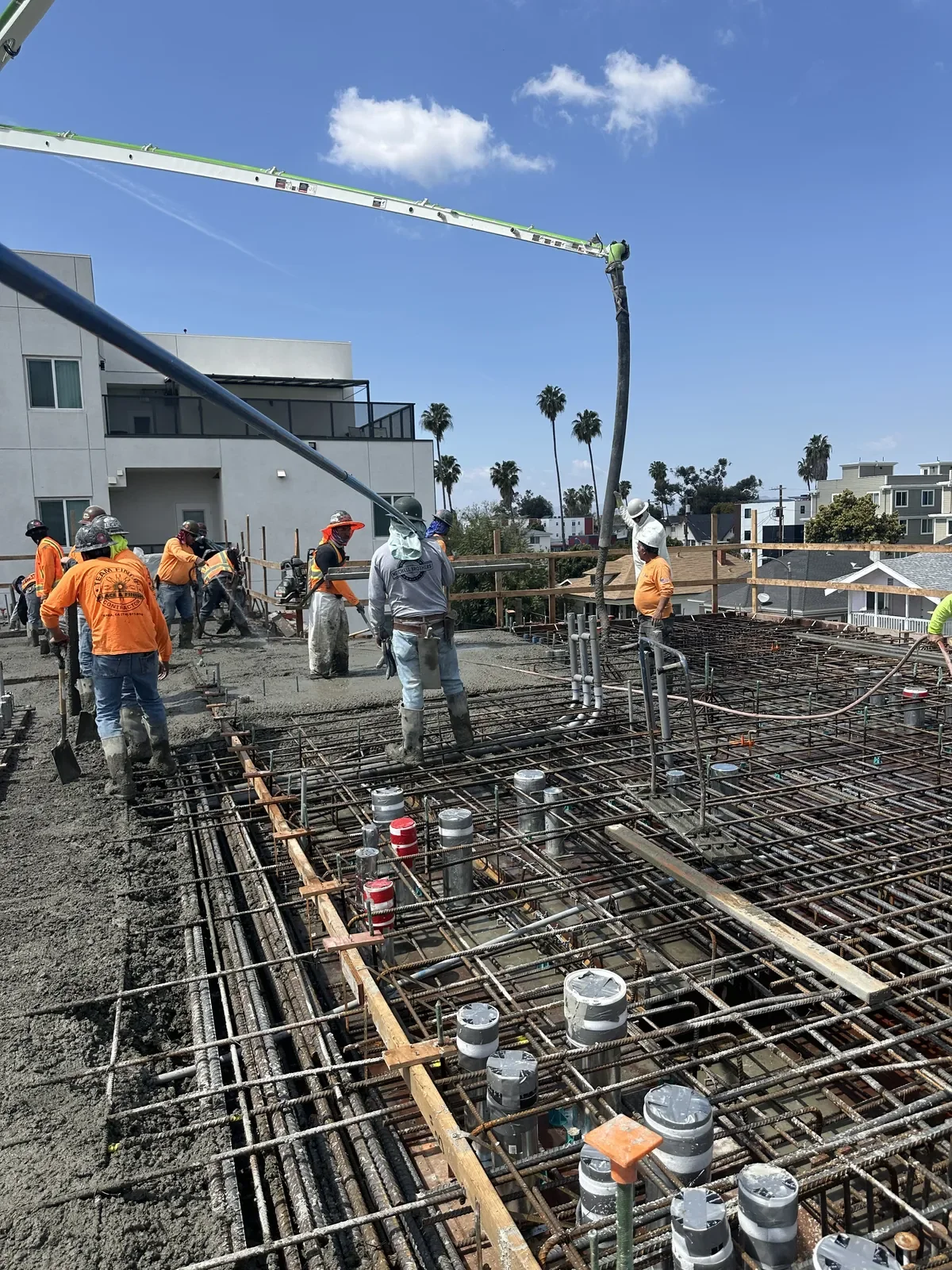 S&P Concrete crew placing a pump-truck pour over a reinforced rebar grid