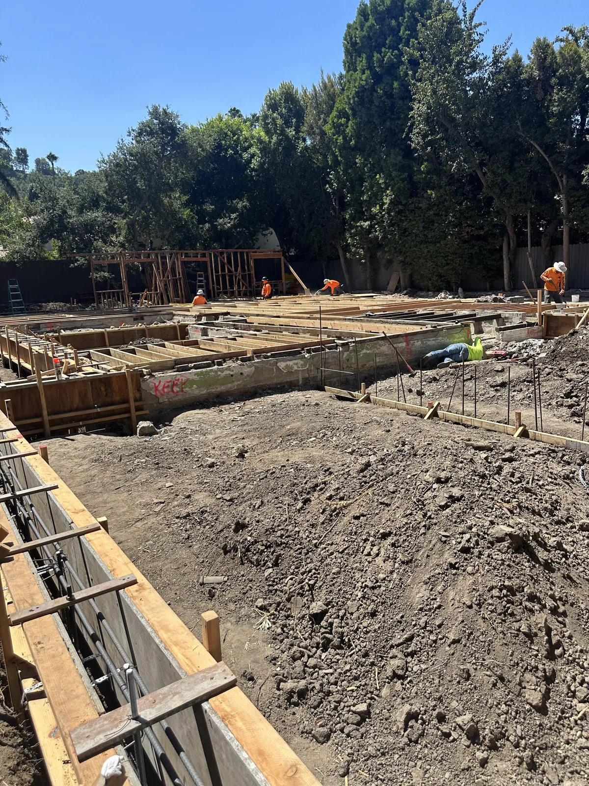 Foundation walls being formed with rebar dowels