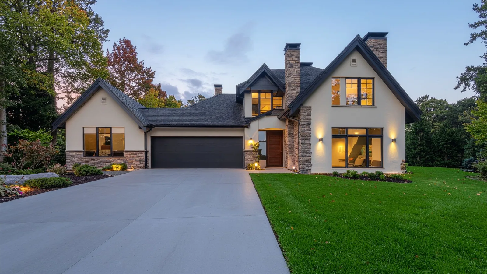 Newly poured residential concrete driveway in front of a modern home